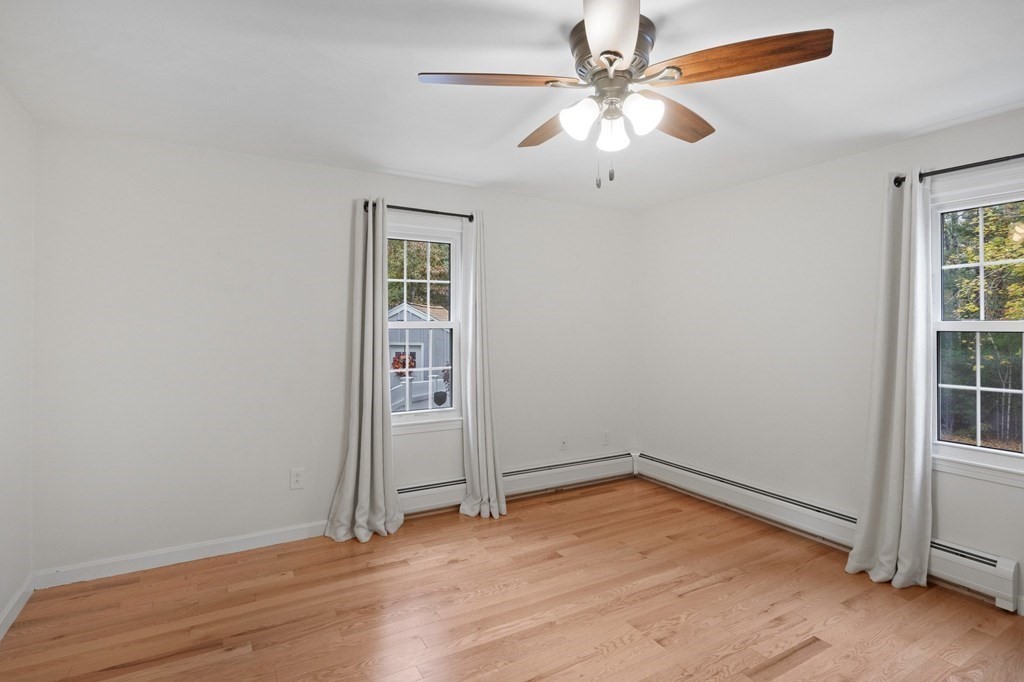 29 Stuart Road Rochester, MA 02770 - Photo 29 of 41 an empty room with closet and a ceiling fan