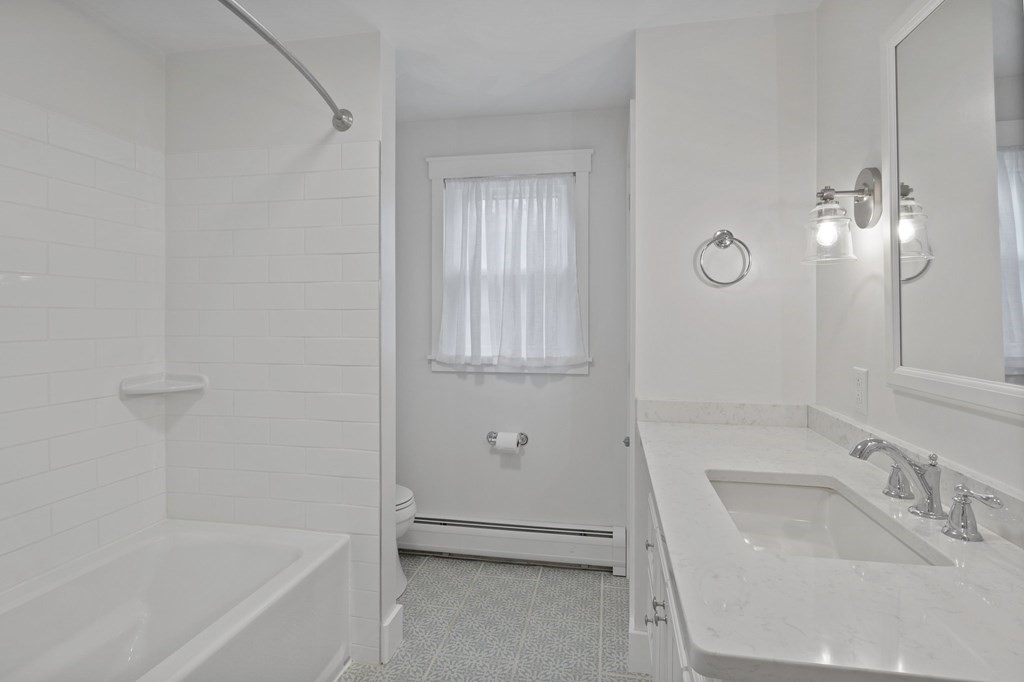 29 Stuart Road Rochester, MA 02770 - Photo 30 of 41 a bathroom with a tub sink and mirror