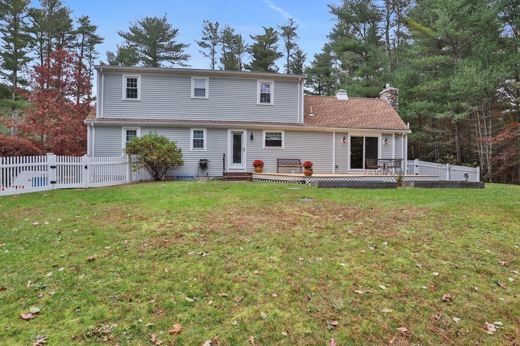 29 Stuart Road Rochester, MA 02770 - Photo 38 of 41 a front view of a house with a yard and trees