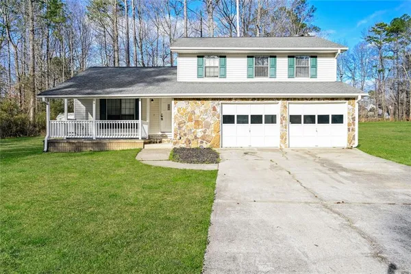front view of a house with a yard
