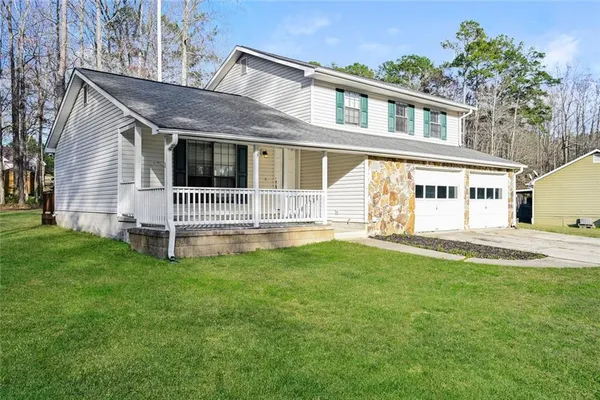 front view of a house with a yard