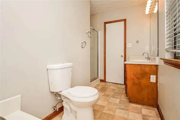 a bathroom with a toilet a sink and a bathtub
