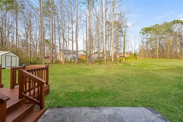 a view of a deck with open backyard
