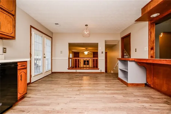 a view of a kitchen with a sink and a window