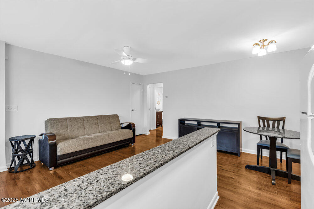 1304 Ocean Avenue, Unit 2A Belmar, NJ 07719 - Photo 13 of 25 a living room with furniture and wooden floor