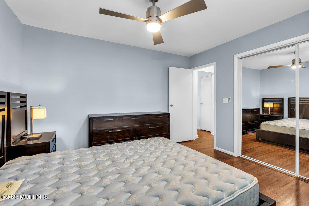 1304 Ocean Avenue, Unit 2A Belmar, NJ 07719 - Photo 15 of 25 a bedroom with a bed and a large mirror