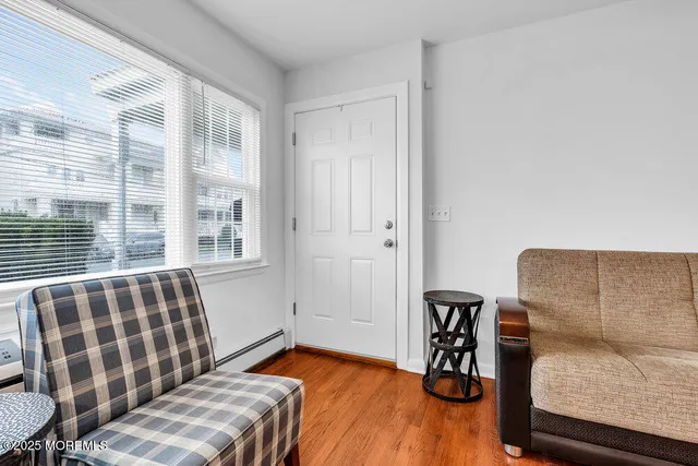 a bedroom with furniture and a window