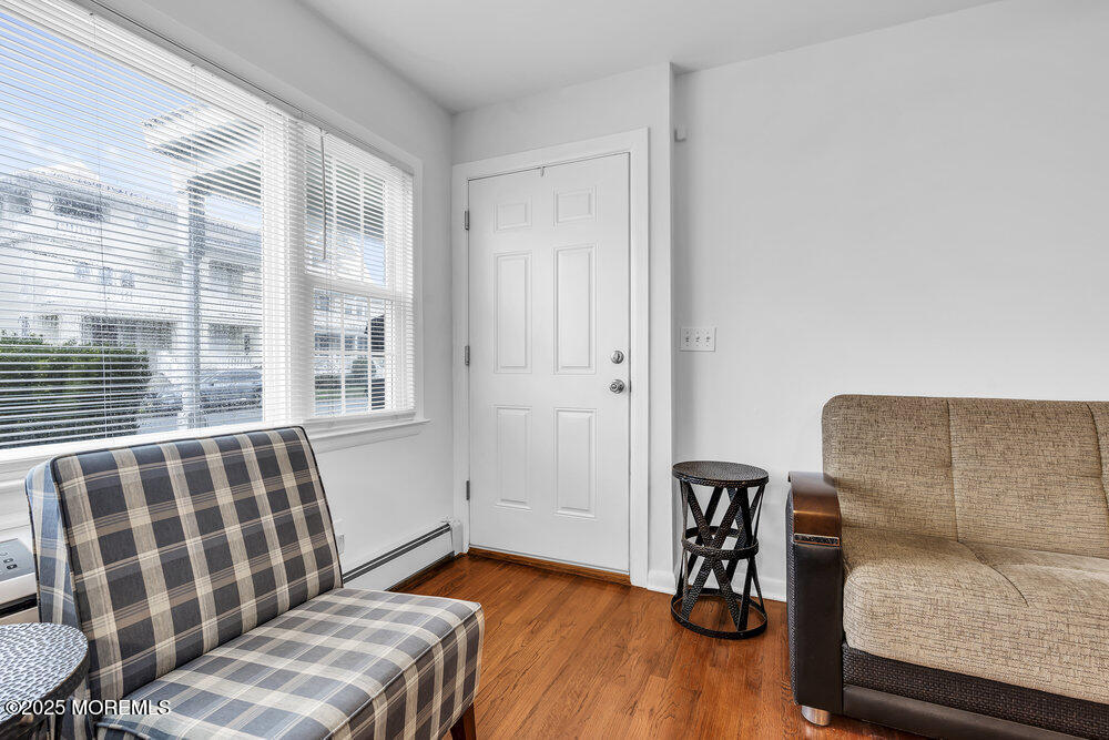 1304 Ocean Avenue, Unit 2A Belmar, NJ 07719 - Photo 4 of 25 a bedroom with furniture and a window