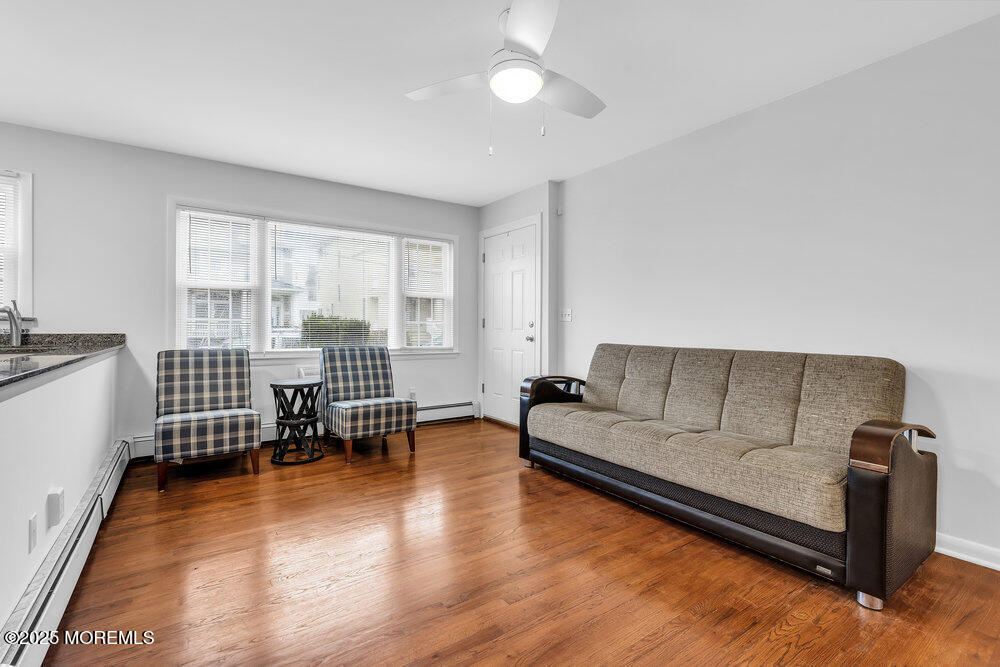 1304 Ocean Avenue, Unit 2A Belmar, NJ 07719 - Photo 7 of 25 a living room with furniture and a wooden floor