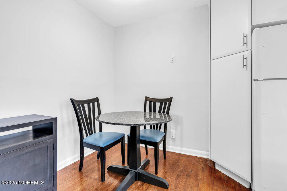1304 Ocean Avenue, Unit 2A Belmar, NJ 07719 - Photo 8 of 25 a view of a room with furniture wooden floor and fan