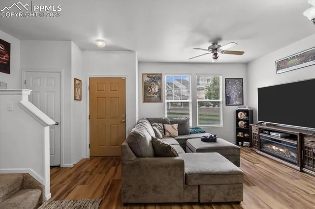 a living room with furniture and a flat screen tv