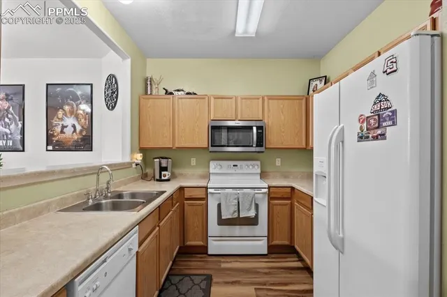 a kitchen with a sink a stove a refrigerator and a sink