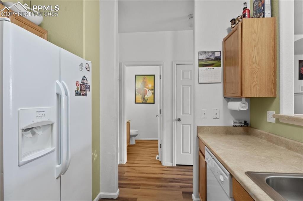 1649 Reilly Grove Colorado Springs, CO 80951 - Photo 6 of 20 a kitchen with a refrigerator and a sink