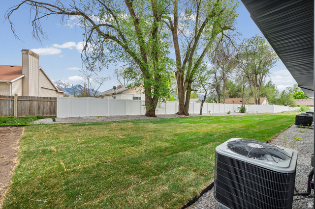 340 East 7635 S Street Sandy, UT 84047 - Photo 30 of 32 Fenced backyard featuring a patio