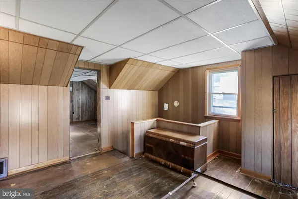 a view of a room with wooden walls