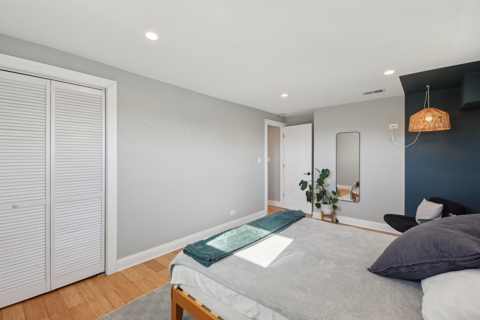 5709 South Austin Avenue Chicago, IL 60638 - Photo 21 of 30 a bed room with a bed and a potted plant