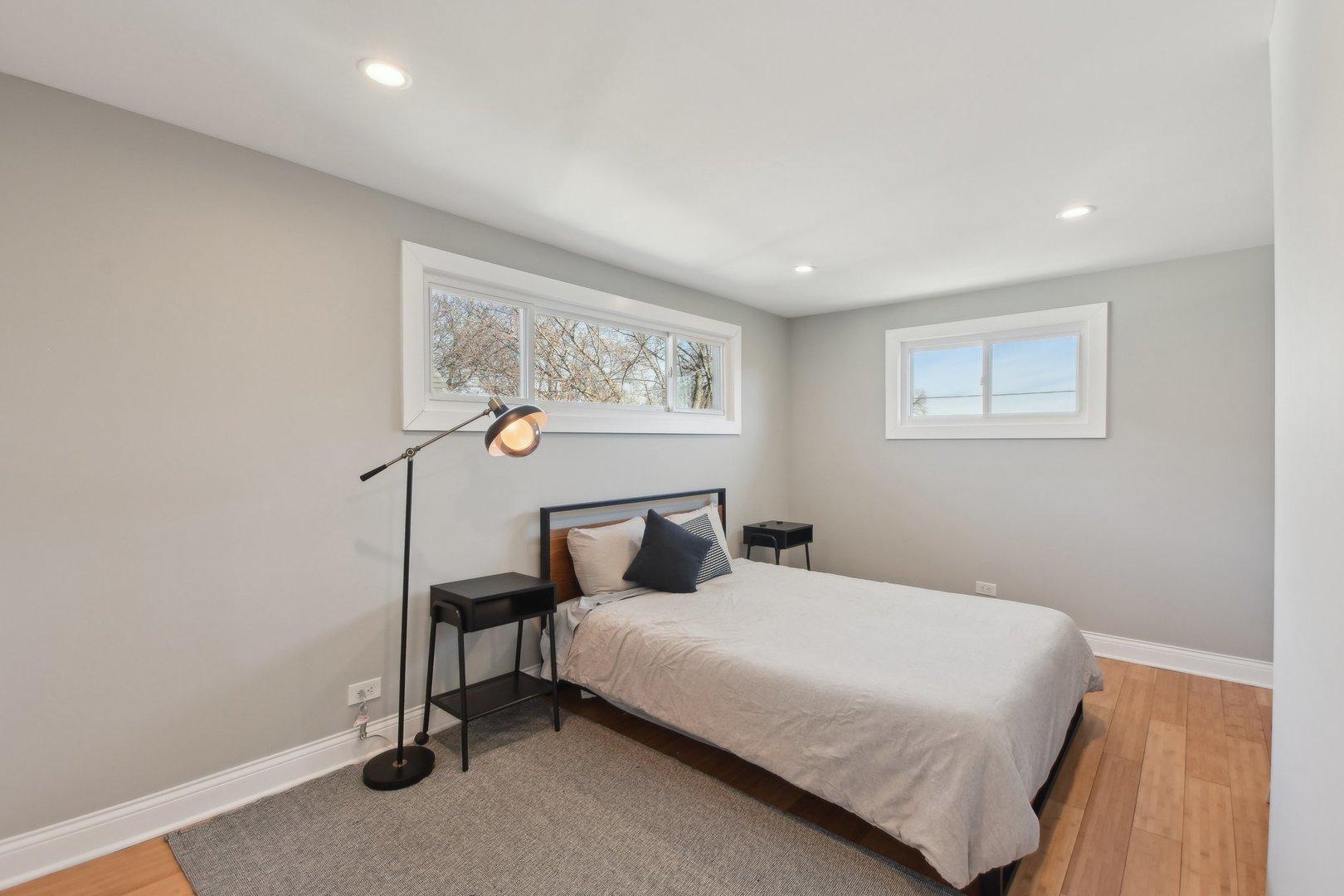 5709 South Austin Avenue Chicago, IL 60638 - Photo 22 of 30 a bedroom with a bed and a painting on the wall