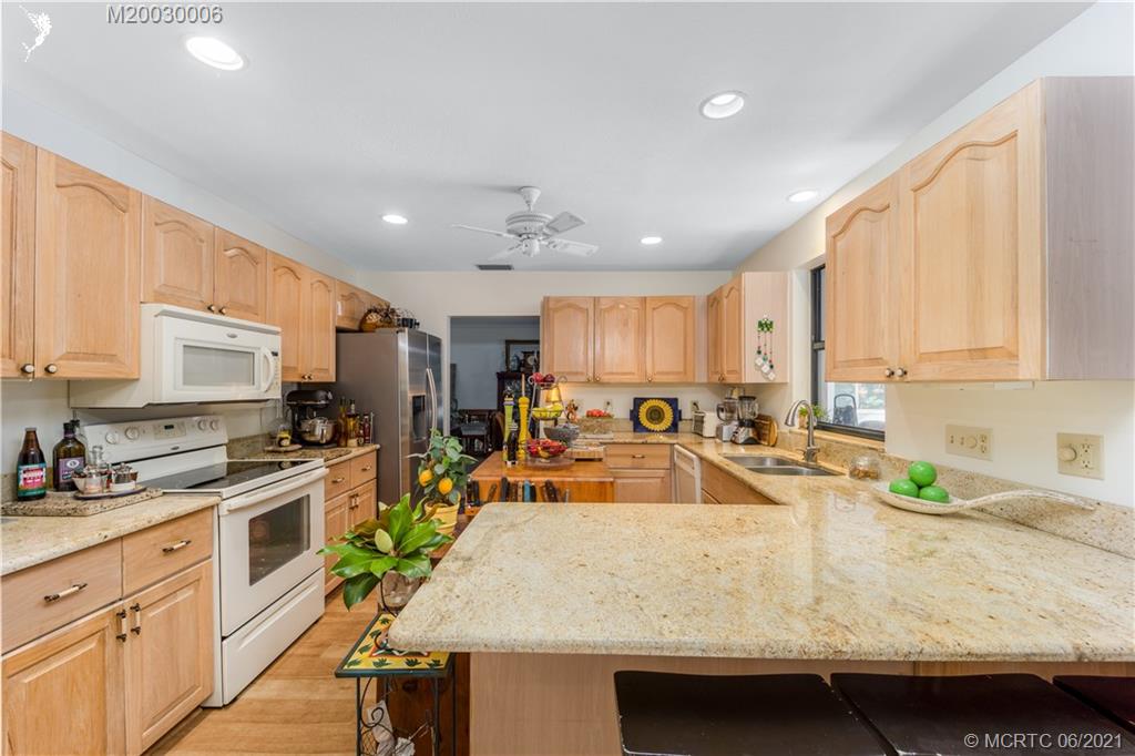 44 Rio Vista Drive Stuart, FL 34996 - Photo 11 of 36 Kitchen Opens to Family room with Casual Breakfast Bar.
