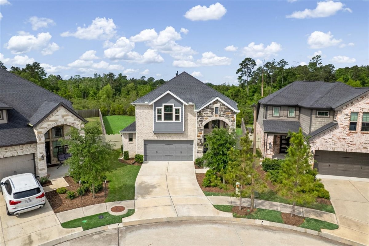 17814 Tree Of Heaven Conroe, TX 77385 - Photo 8 of 48 Stunning two-story home with attractive curb appeal, located on a quiet cul-de-sac with a premium oversized lot.