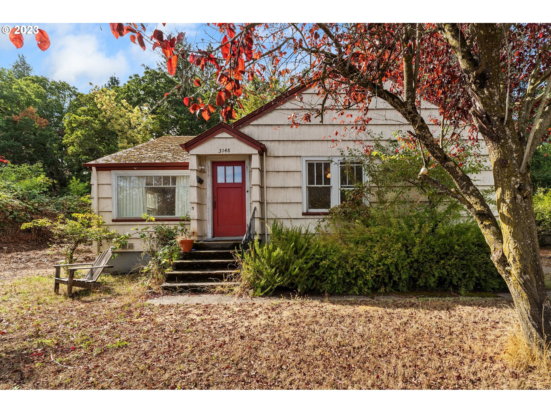 3148 Willamette Street Eugene, OR 97405 - Photo 1 of 31 a front view of a house with a garden