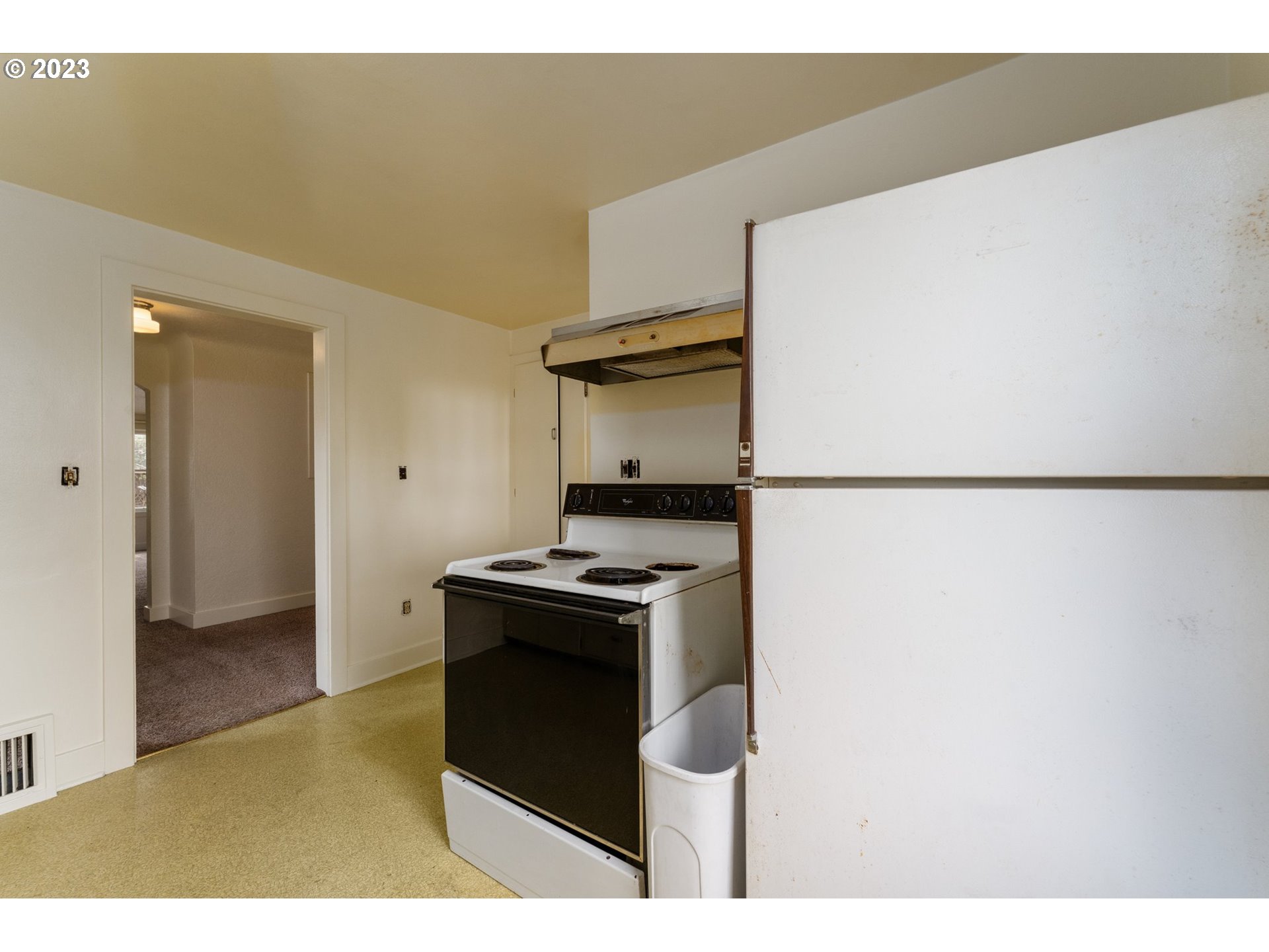 3148 Willamette Street Eugene, OR 97405 - Photo 11 of 31 a kitchen with a stove and a refrigerator