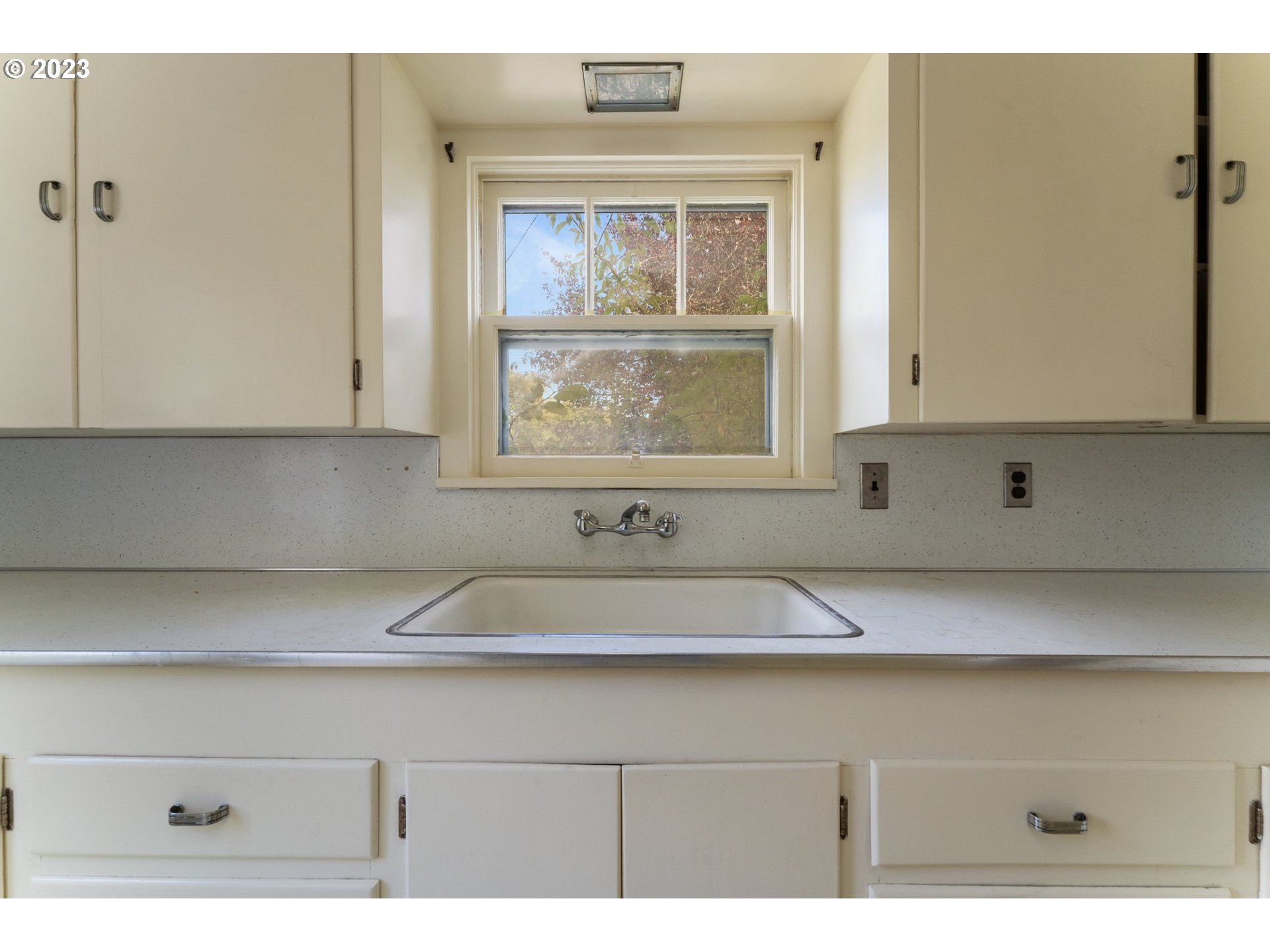 3148 Willamette Street Eugene, OR 97405 - Photo 13 of 31 a kitchen with a sink and cabinets