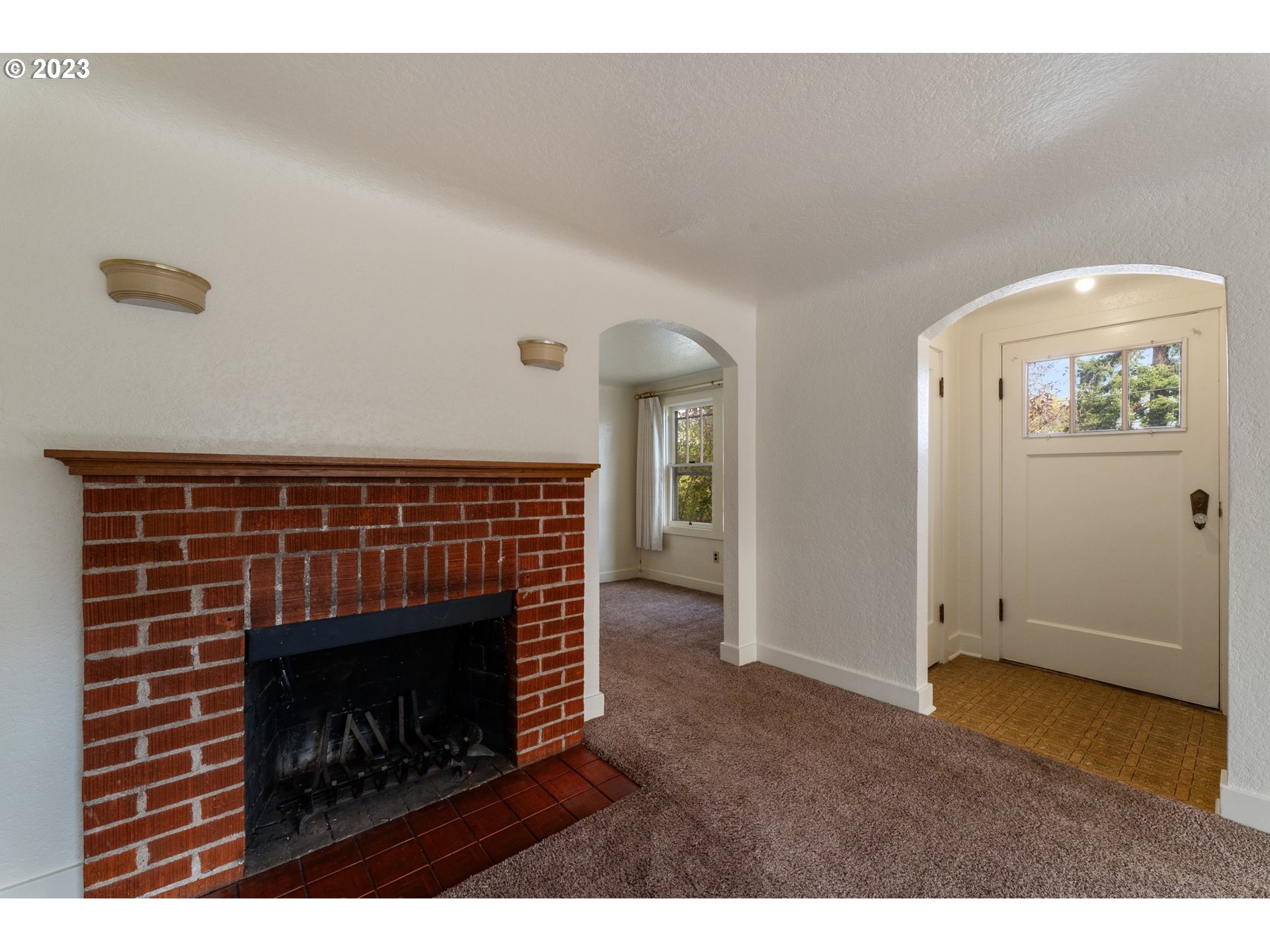 3148 Willamette Street Eugene, OR 97405 - Photo 14 of 31 a living room with furniture and a fireplace