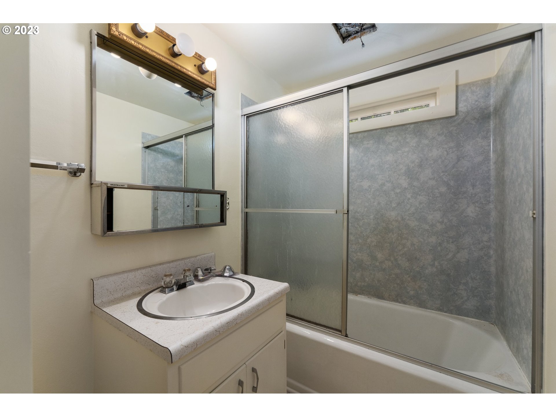 3148 Willamette Street Eugene, OR 97405 - Photo 17 of 31 a bathroom with a sink and mirror