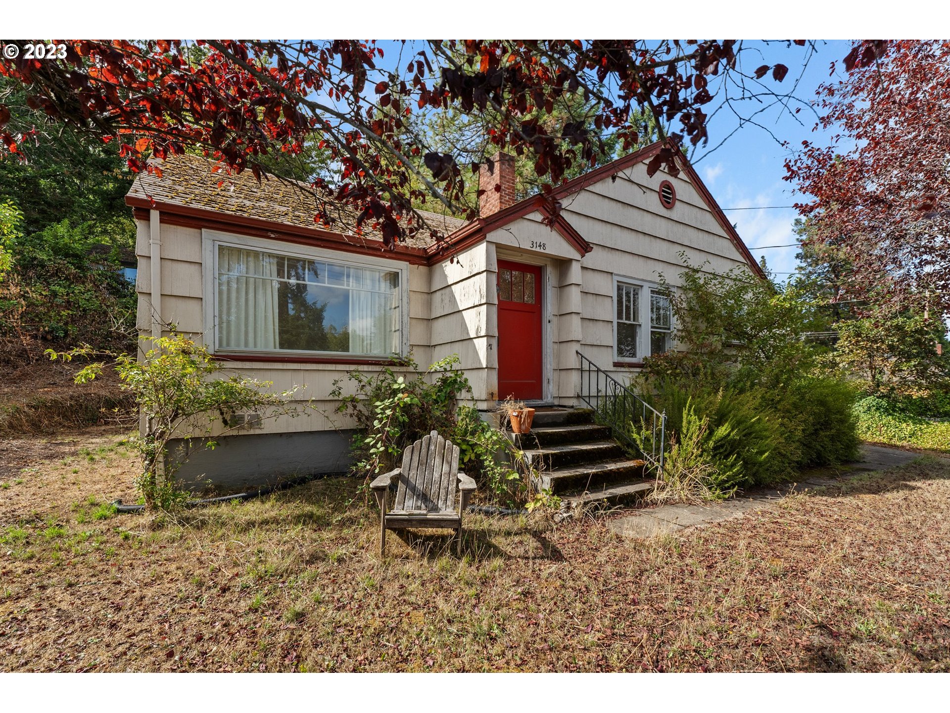 3148 Willamette Street Eugene, OR 97405 - Photo 18 of 31 a front view of a house with a garden