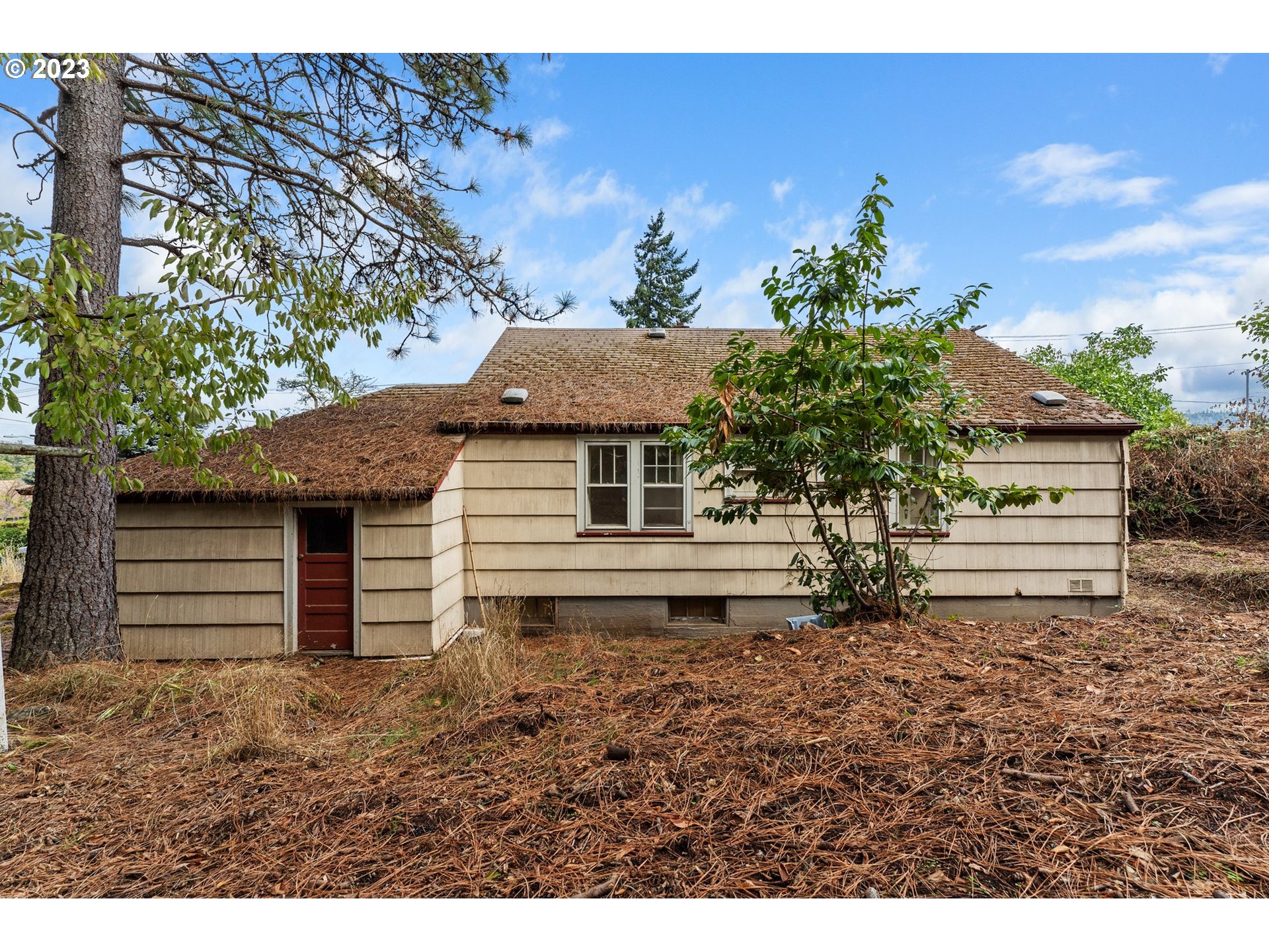 3148 Willamette Street Eugene, OR 97405 - Photo 28 of 31 a view of a house with a yard