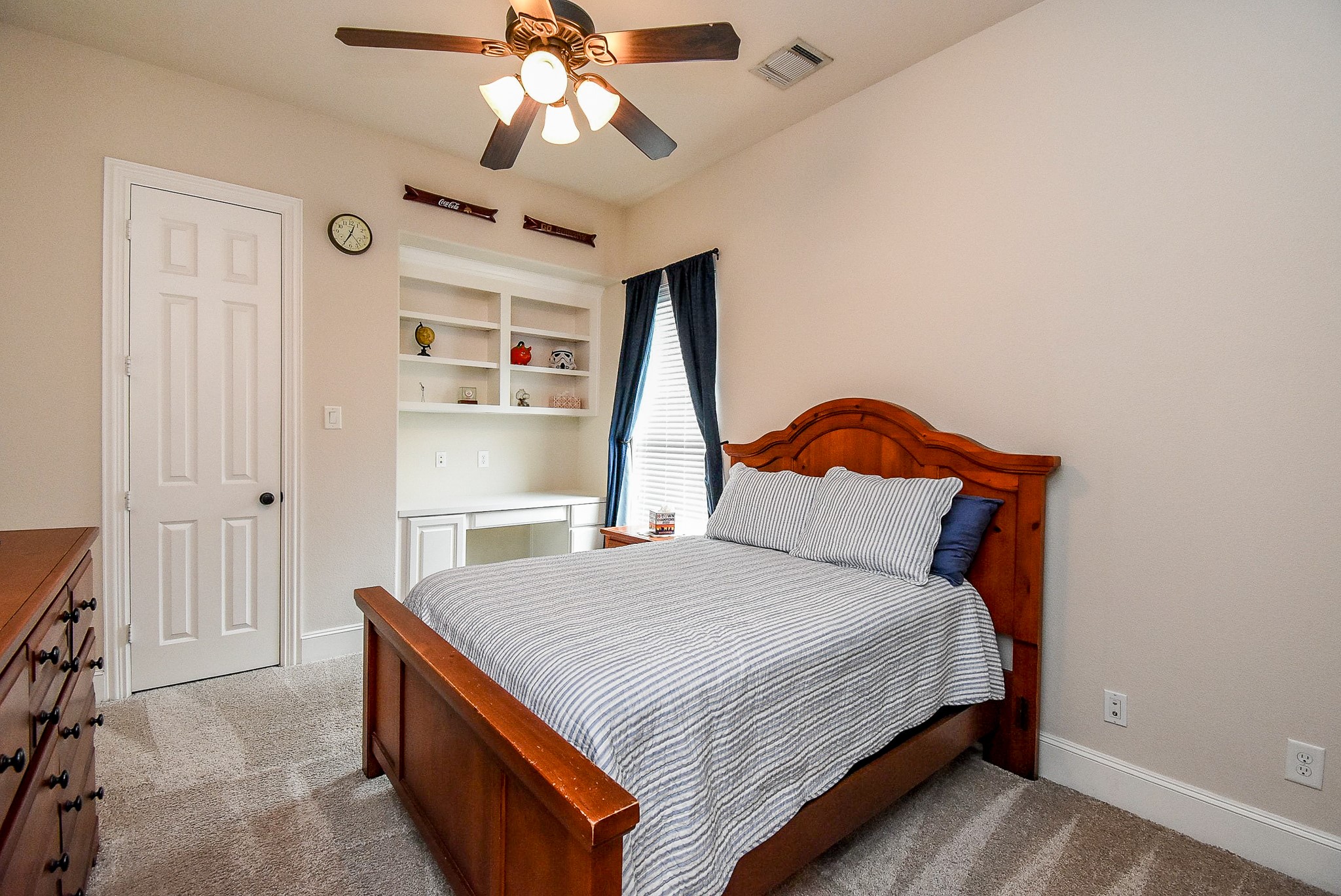27427 Guthrie Ridge Lane Katy, TX 77494 - Photo 32 of 48 a bedroom with a bed and a chandelier