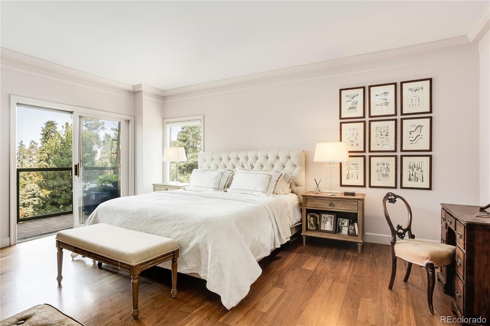 1133 Race Street, Unit 5A Denver, CO 80206 - Photo 15 of 33 a bedroom with a bed and a large window