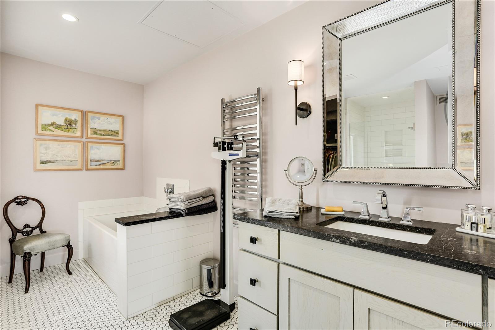 1133 Race Street, Unit 5A Denver, CO 80206 - Photo 19 of 33 a kitchen with a sink dishwasher a stove and white cabinets with wooden floor
