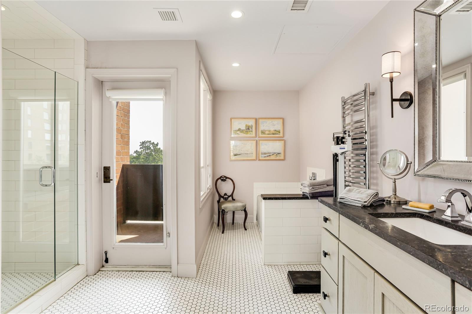 1133 Race Street, Unit 5A Denver, CO 80206 - Photo 20 of 33 a hallway with sink and mirror