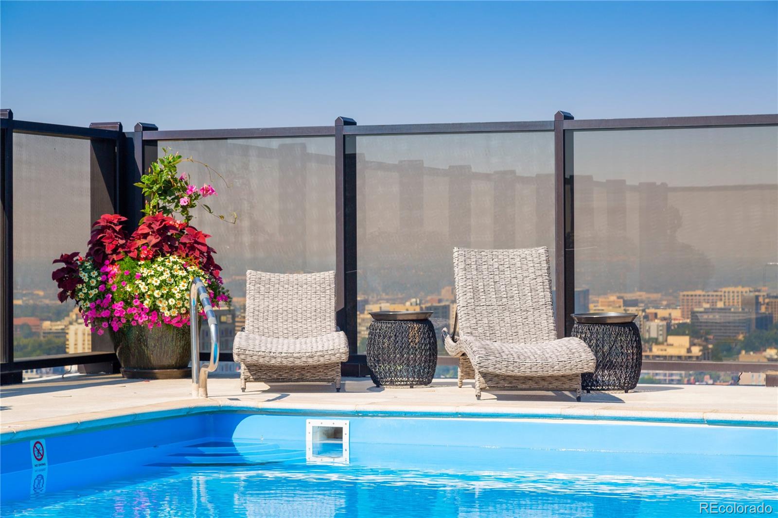1133 Race Street, Unit 5A Denver, CO 80206 - Photo 21 of 33 a living room with furniture and flowers