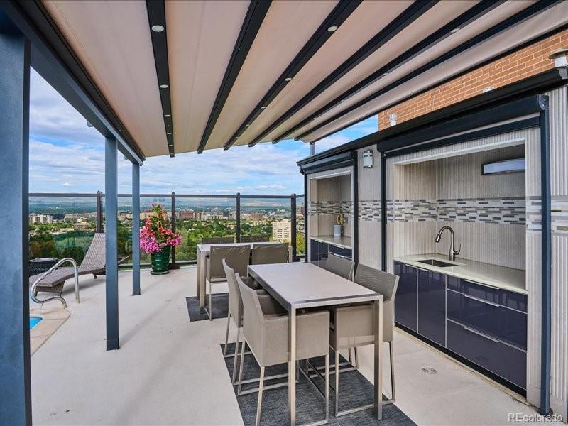 1133 Race Street, Unit 5A Denver, CO 80206 - Photo 22 of 33 a dinning area with a table and chairs