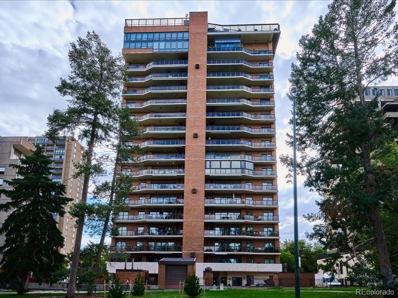 1133 Race Street, Unit 5A Denver, CO 80206 - Photo 30 of 33 a front view of a building with glass windows and brick walls