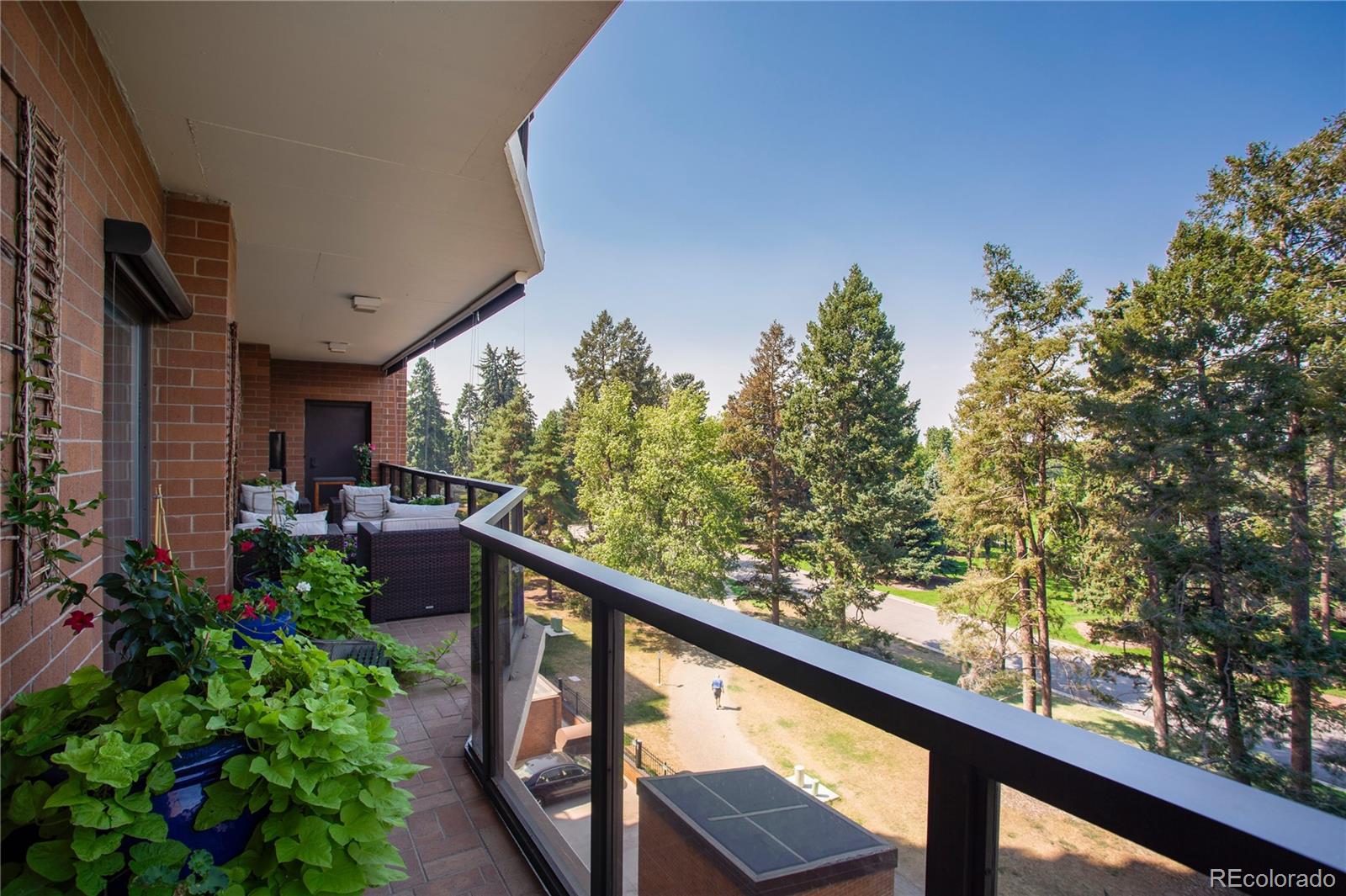 1133 Race Street, Unit 5A Denver, CO 80206 - Photo 8 of 33 a view of a balcony with flower plants