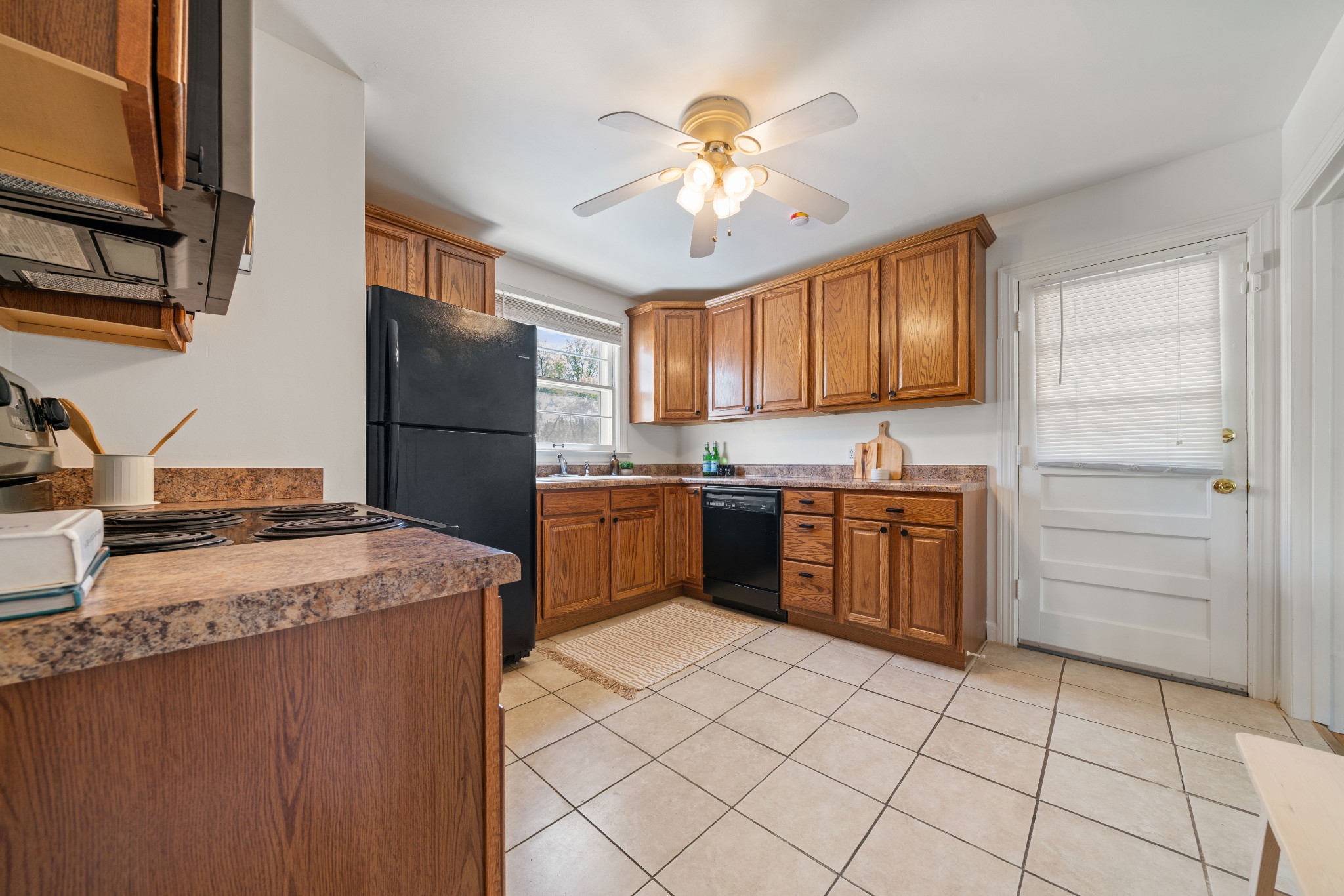 3926 East Ridge Drive Nashville, TN 37211 - Photo 15 of 38 a kitchen with a stove sink and refrigerator