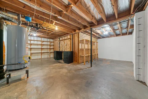 a view of an empty room with a fireplace