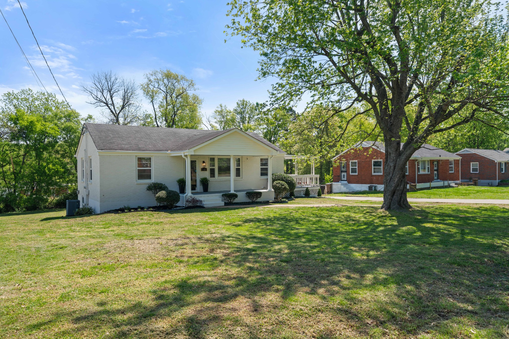 3926 East Ridge Drive Nashville, TN 37211 - Photo 4 of 38 a front view of a house with yard porch and green space