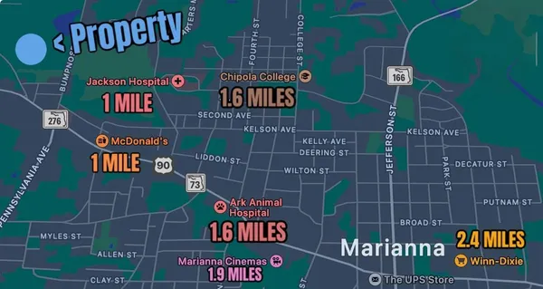 a street sign on a wall next to a building