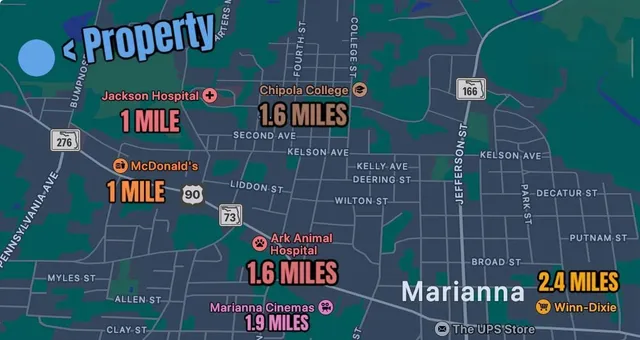 a street sign on a wall next to a building