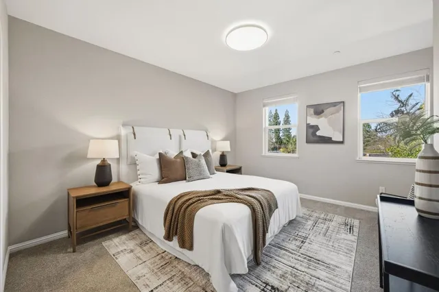 a bedroom with a bed and a desk