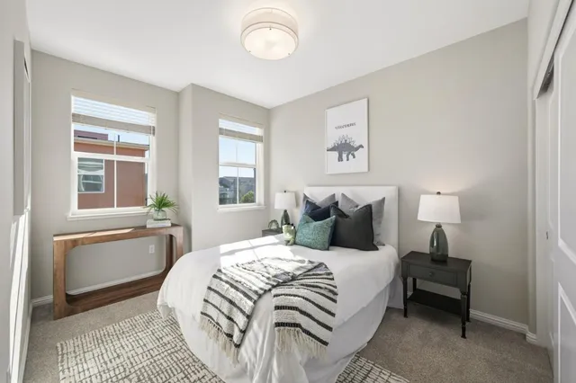 a bedroom with a large bed and a window