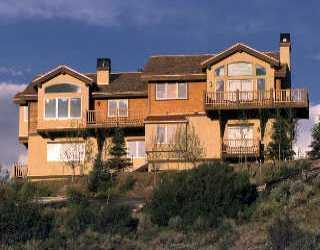 153 Knudson Ranch Road Edwards, CO 81632 - Photo 1 of 2 a front view of a house with a yard