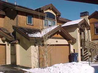 153 Knudson Ranch Road Edwards, CO 81632 - Photo 2 of 2 a view of a house with a wooden fence