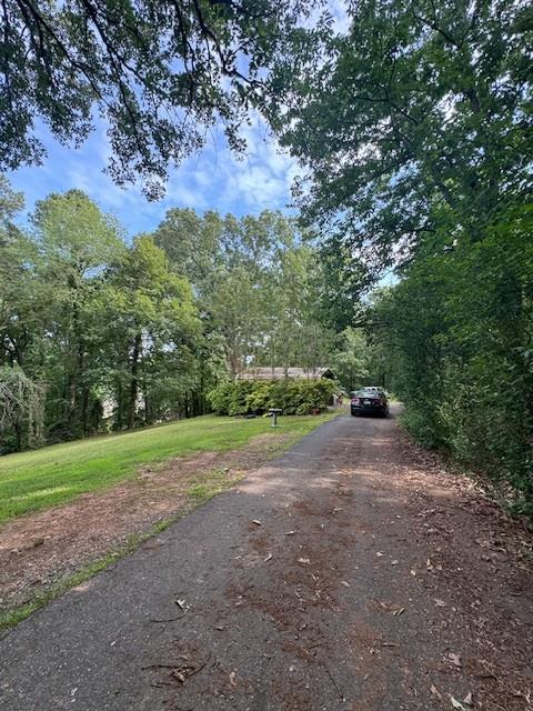 220 Ridgecrest Road Southeast Mableton, GA 30126 - Photo 7 of 12 a view of a field with trees in background