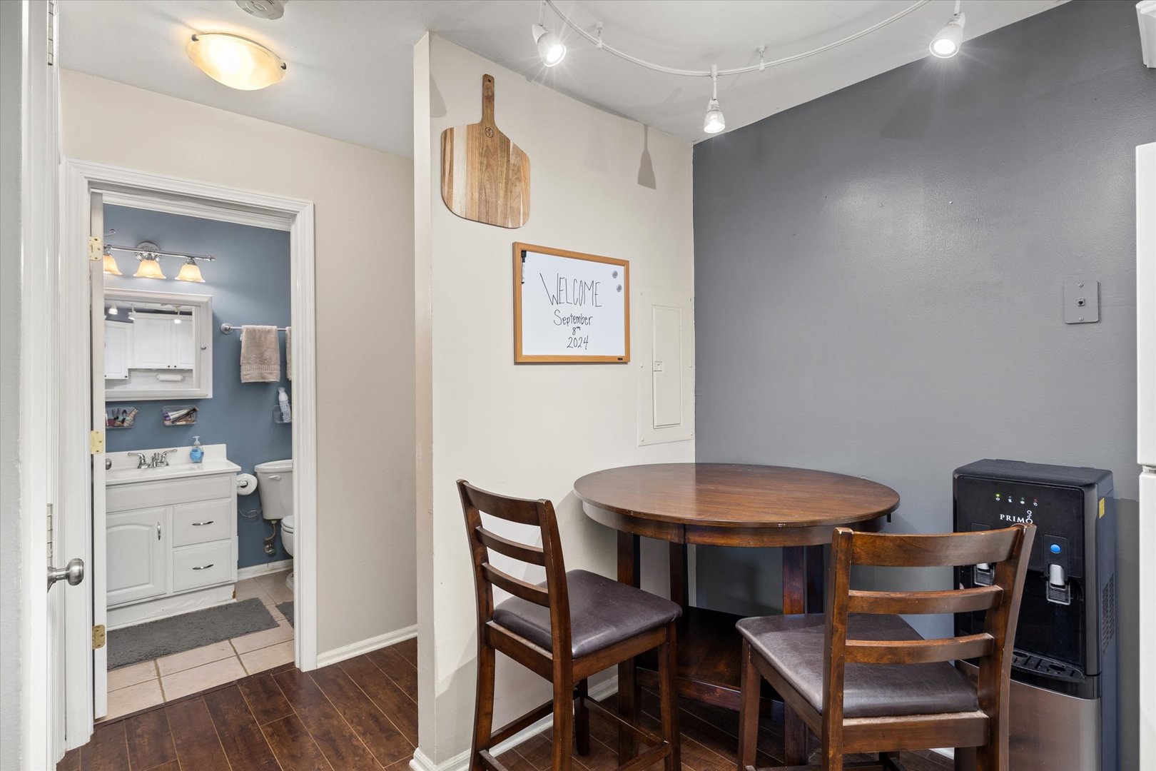 2400 Light Road, Unit 111 Oswego, IL 60543 - Photo 11 of 27 a view of a dining room with furniture and wooden floor