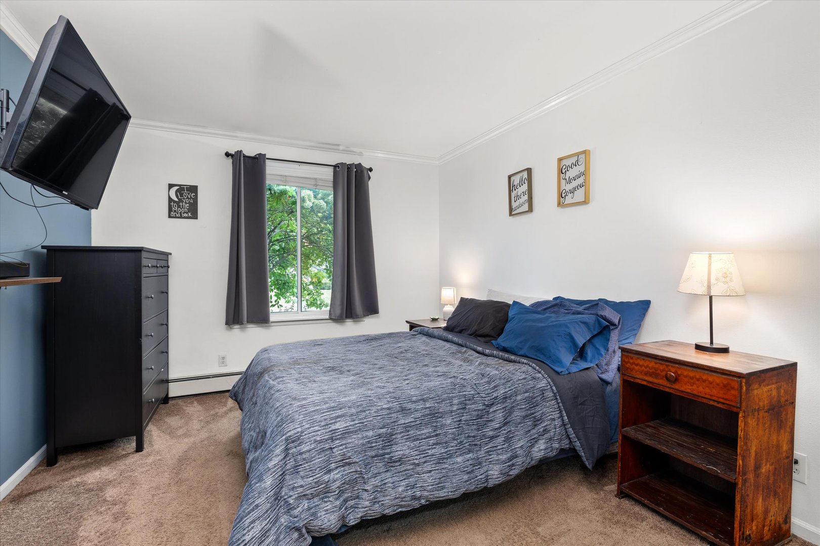 2400 Light Road, Unit 111 Oswego, IL 60543 - Photo 12 of 27 a bedroom with a bed and a flat screen tv